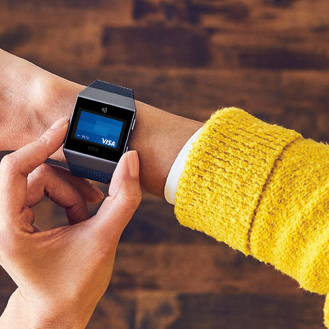 Person using the Visa digital wallet on their smart watch to make a payment
