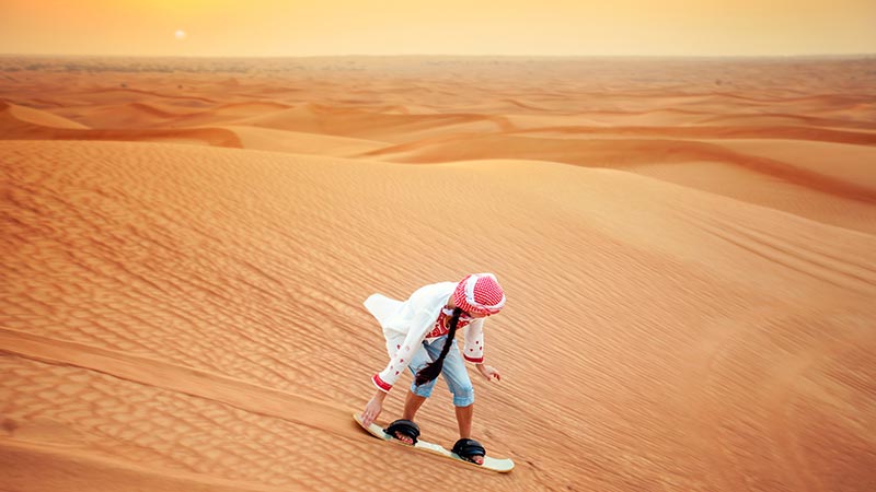 Sand boarding, desert Safari, Dubai, UAE